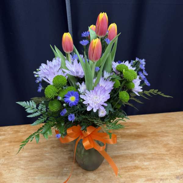 Mixed bouquet with tulips and chrysanthemums in a vase