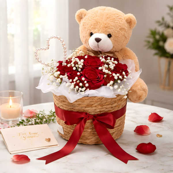 Teddy bear in a basket of red roses with a heart decoration