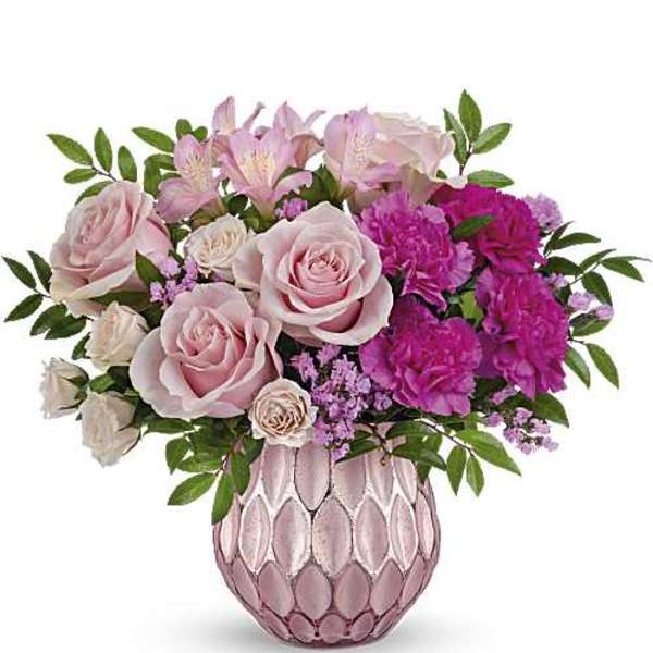 Pink roses and carnations arranged in a pink textured vase