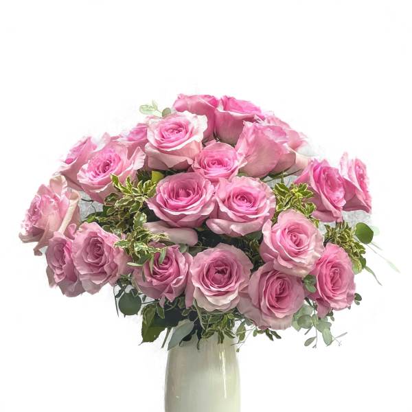 Pink rose bouquet in a tall white vase