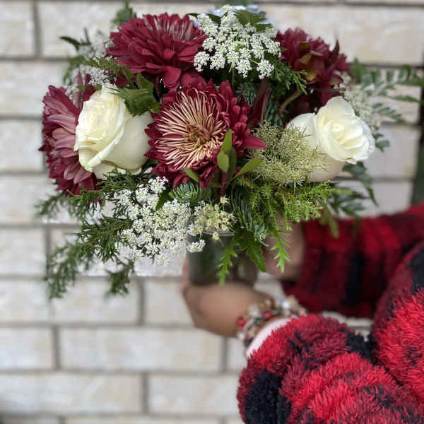 Bouquet of burgundy and white flowers with greenery