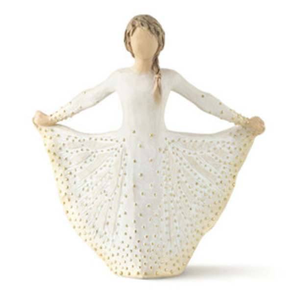 Figurine of a girl in a white dress with gold dots
