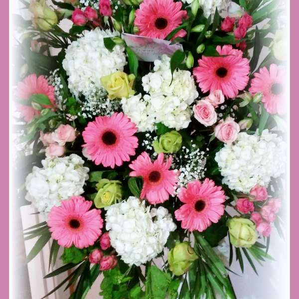 Pink gerbera and white hydrangea bouquet with roses