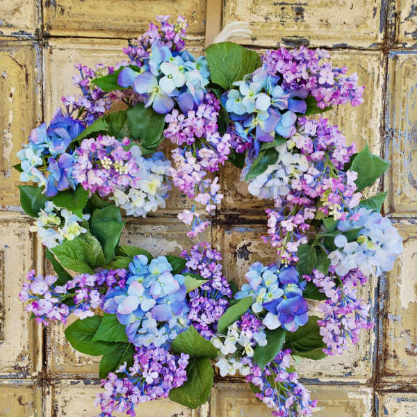 Hydrangea wreath in blue, purple, and pink tones