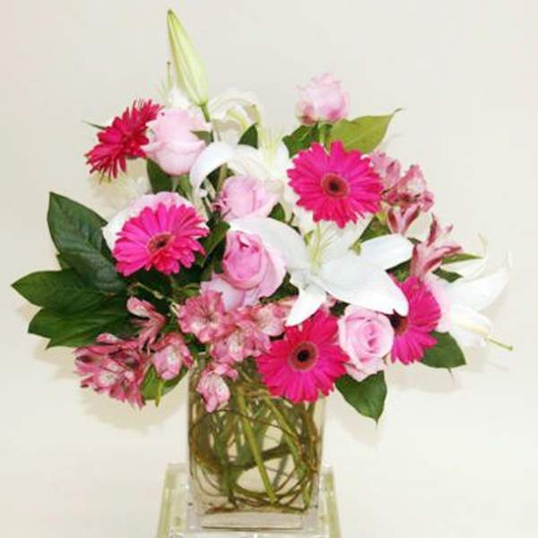 Pink and white mixed bouquet in a clear glass vase