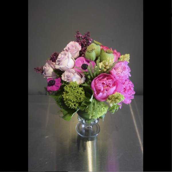 Pink and lavender bouquet in a clear glass vase