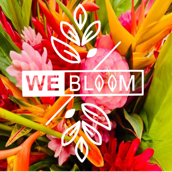 Colorful tropical bouquet with pink, red, and yellow flowers