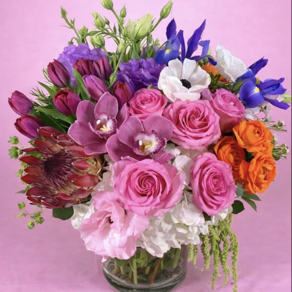 Colorful mixed bouquet in a clear glass vase