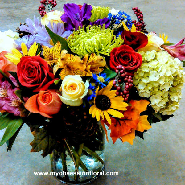 Colorful mixed bouquet in a clear glass vase