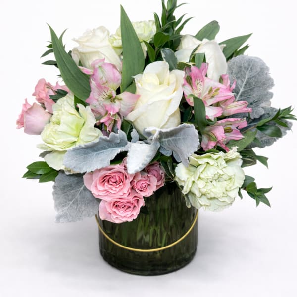 Pink and white roses with alstroemeria in a glass vase