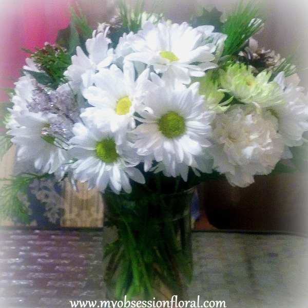 White daisy bouquet in a clear glass vase