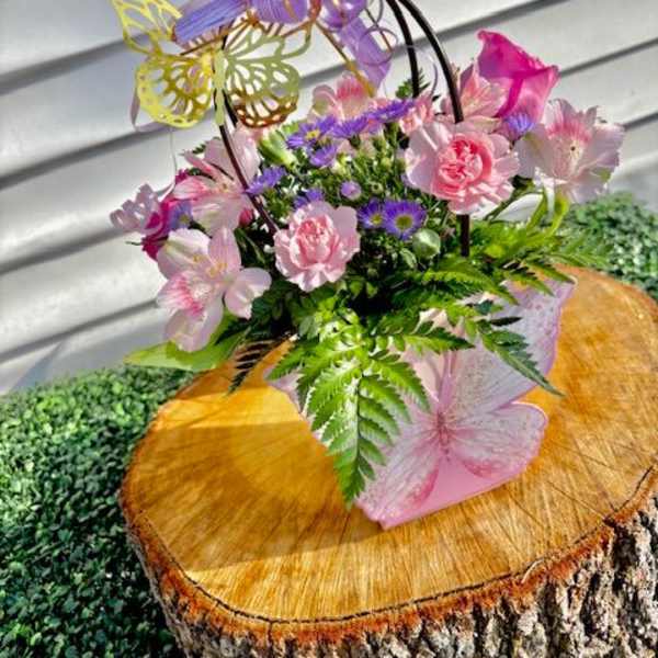 Pink and purple floral basket with butterfly decorations