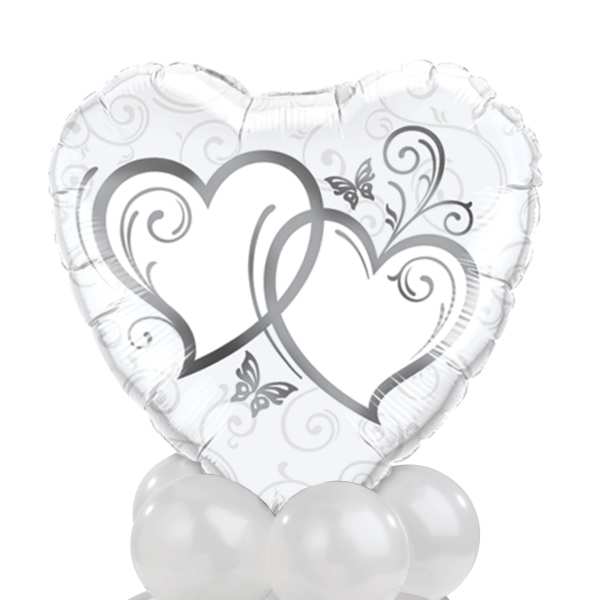 Heart-shaped white balloon with silver heart graphics and white balloons below
