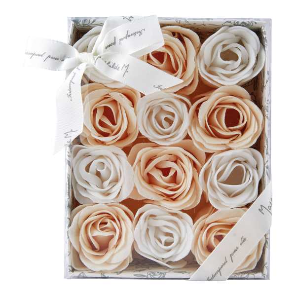Box of cream and peach rose-shaped flowers with a ribbon bow