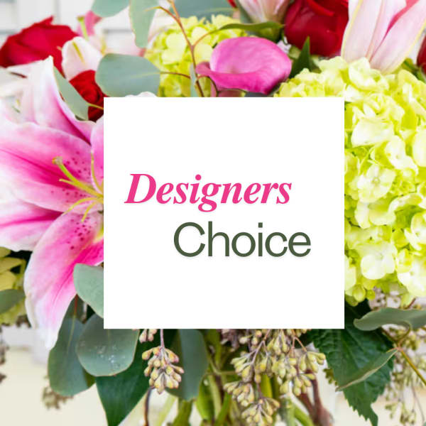 Mixed bouquet with pink lilies, red roses, and pale yellow hydrangeas