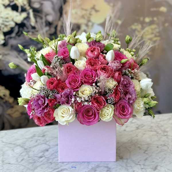 Pink and white rose bouquet in a lavender box