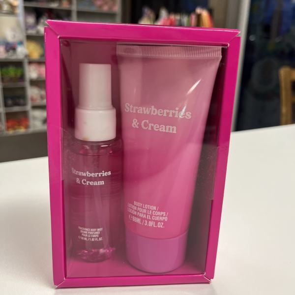 Pink gift set with body mist and lotion labeled Strawberries & Cream