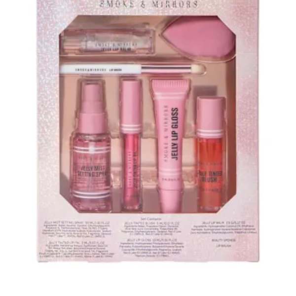 Pink makeup gift set in a glittery box with lip gloss and applicators