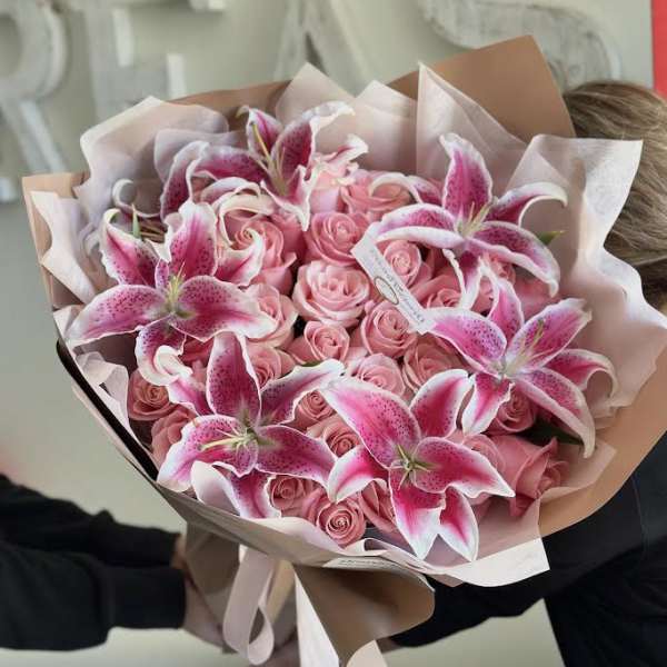 Pink roses and stargazer lilies wrapped in blush paper