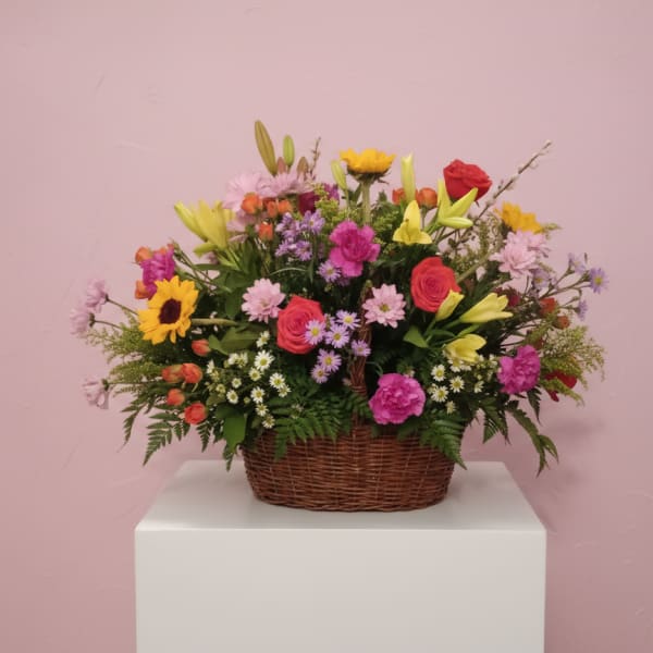 Mixed flower basket with roses, lilies, and daisies