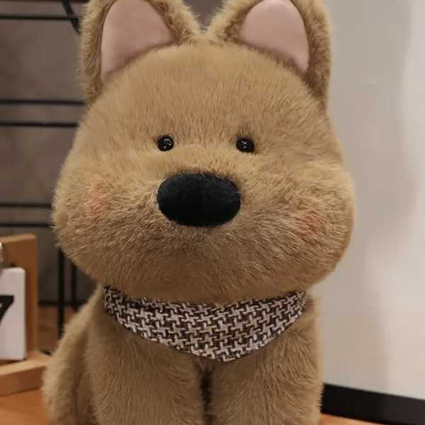 Plush dog toy with fuzzy tan fur and a patterned collar