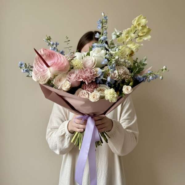 Large pastel bouquet with pink, white, blue, and yellow flowers