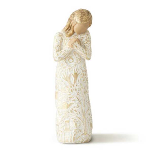 Cream-colored angel figurine with hands clasped in prayer