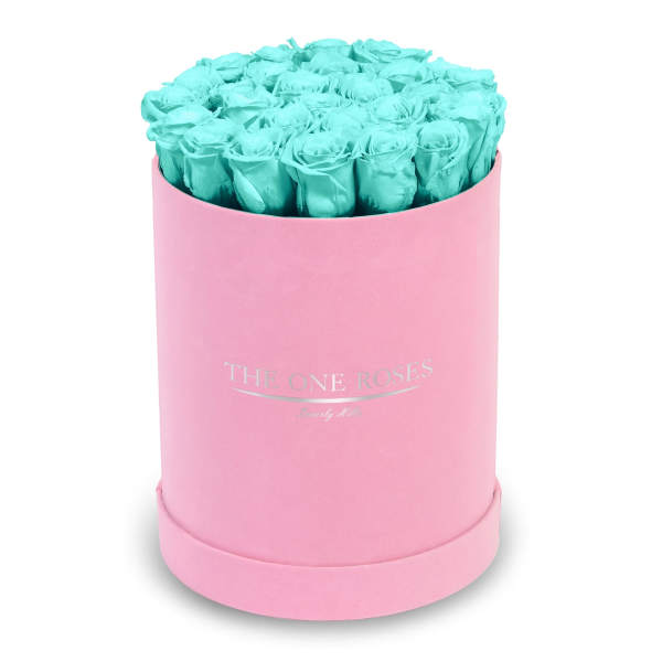 Turquoise roses in a pink round box