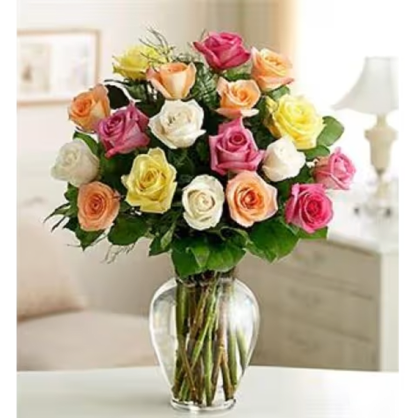 Bouquet of multicolored roses in a clear glass vase