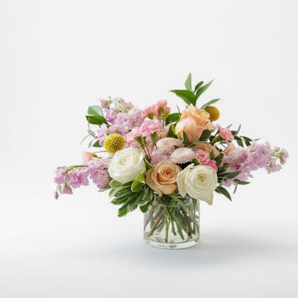 Mixed pastel bouquet in a clear glass vase