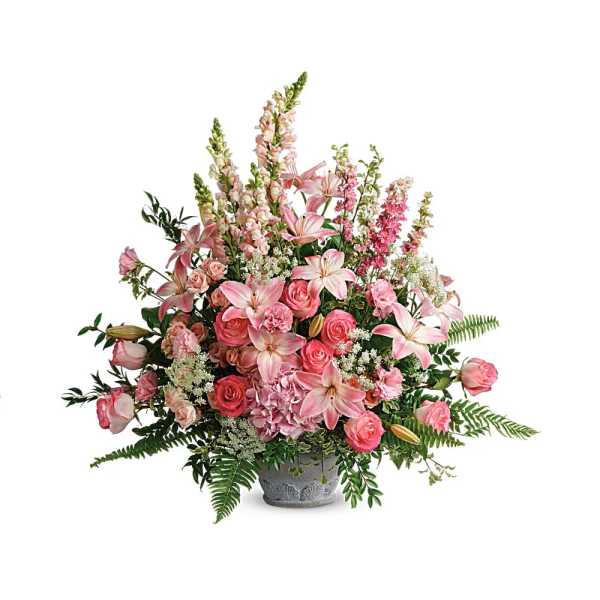 Large pink arrangement with lilies, roses, hydrangea and snapdragons in a gray urn-style container