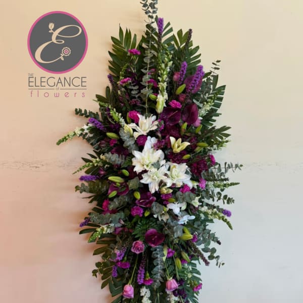 Tall standing floral spray with white, purple, and pink flowers