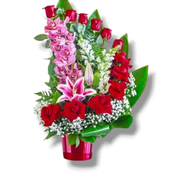 Red roses and pink orchids in a red vase