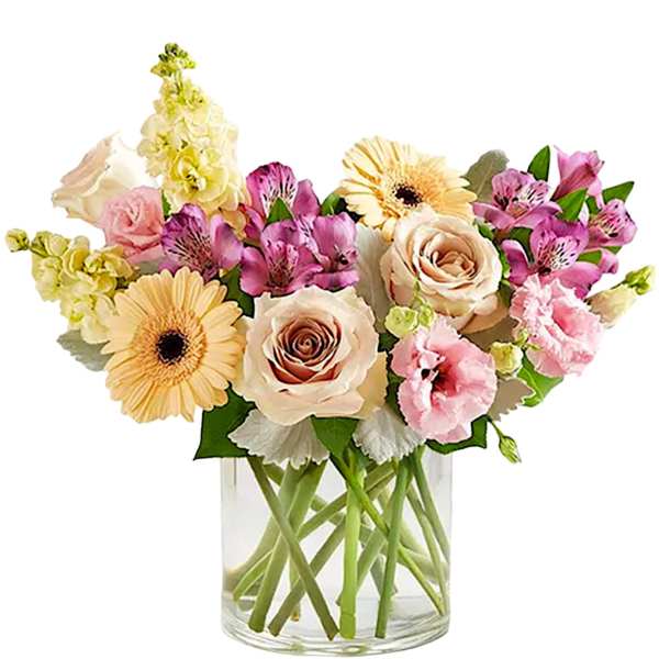 Mixed pastel bouquet in a clear glass vase