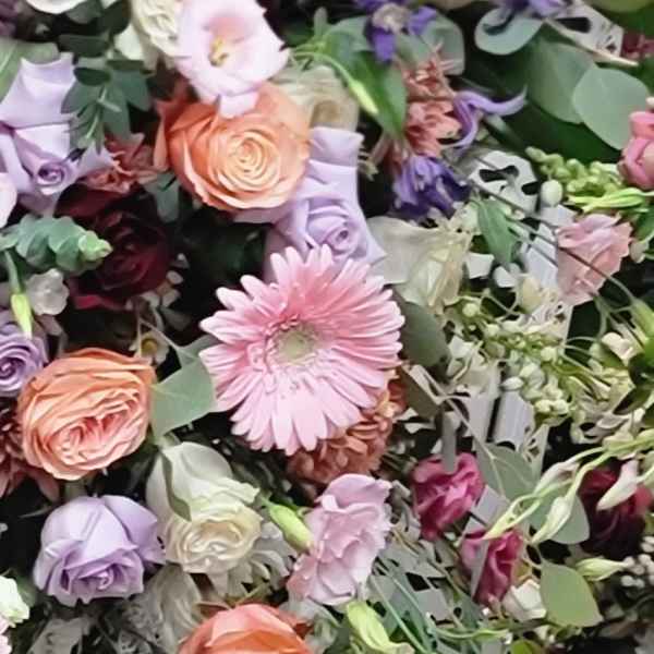 Mixed bouquet with pink, peach, and lavender flowers