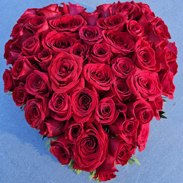 Heart-shaped bouquet of red roses
