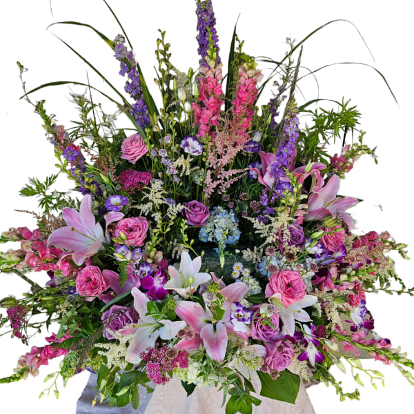 Large mixed bouquet with pink lilies, roses, and purple flowers