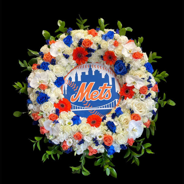 Circular floral wreath around a Mets logo sign