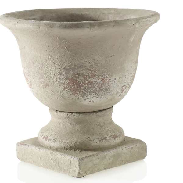Weathered stone urn planter with a wide flared rim
