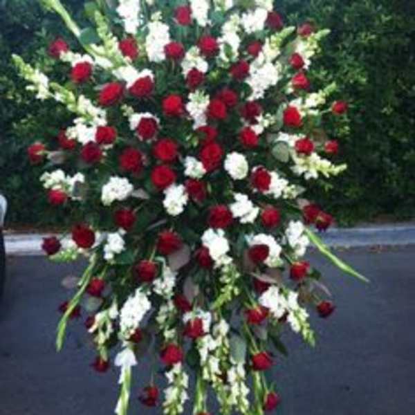 Large standing spray of red and white flowers