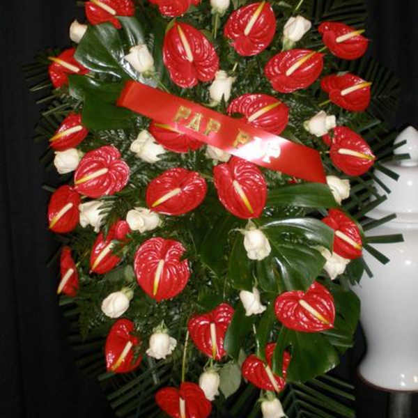 Standing floral spray with red anthuriums and white roses