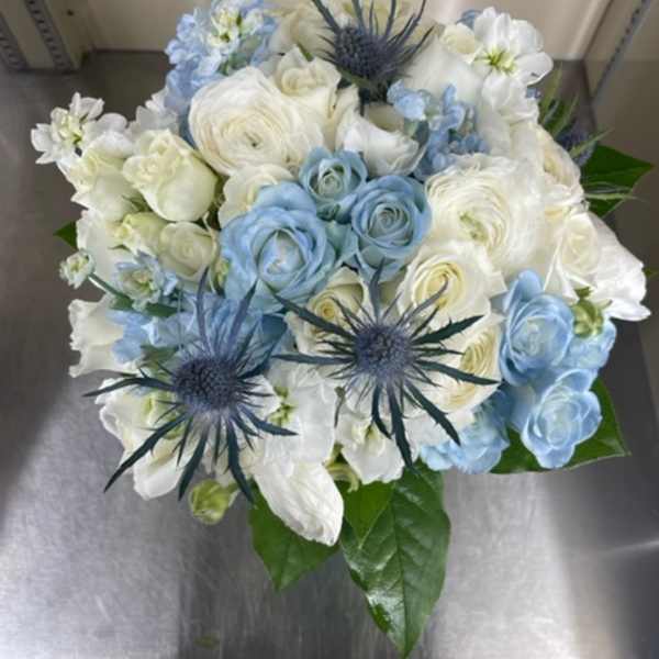 Blue and white bouquet with spiky thistle-like blooms