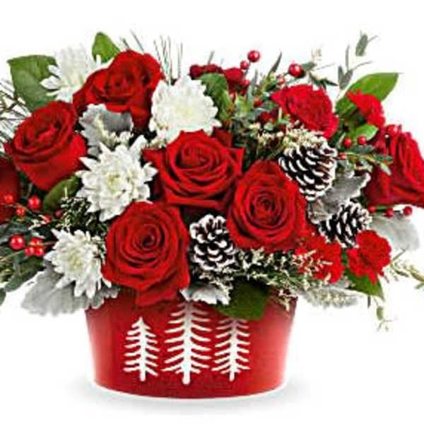Red roses and white flowers in a red holiday container