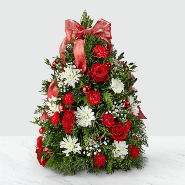 Christmas tree-shaped floral arrangement with red roses and white daisies