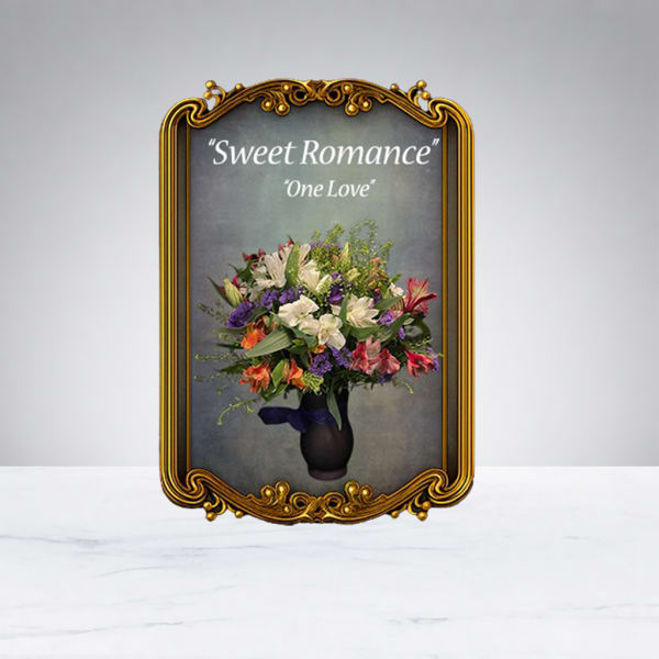 Mixed bouquet in a dark vase with an ornate gold frame