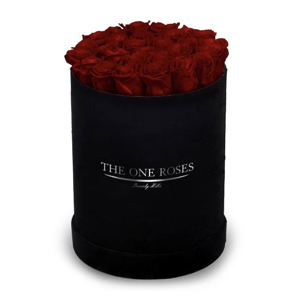 Red roses arranged in a black round box
