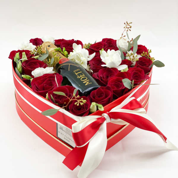 Heart-shaped box of red and white roses with a mini Moet bottle