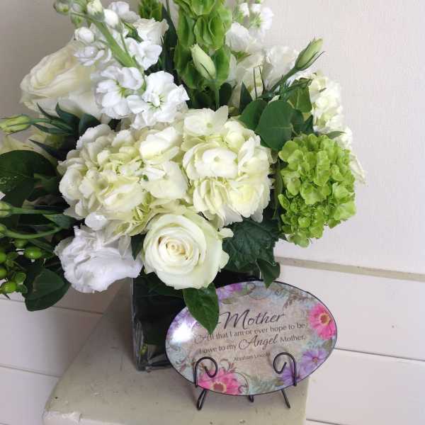 White and green floral arrangement with a Mother plaque