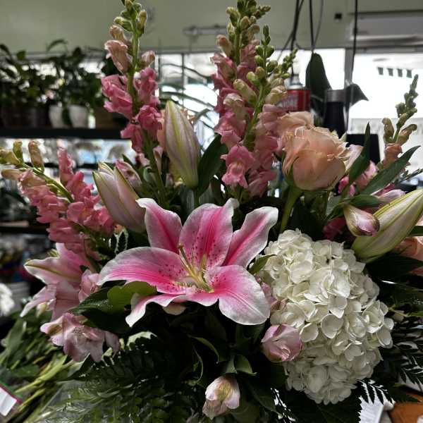 Pink lilies and white hydrangea in a mixed bouquet