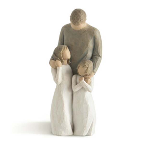 Wooden figurine of a family of three in neutral tones